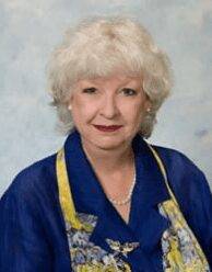 Portrait of older woman in blue outfit